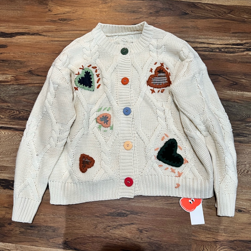 Cider Cream Cable Knit Cardigan with Multicolor Heart Appliqués